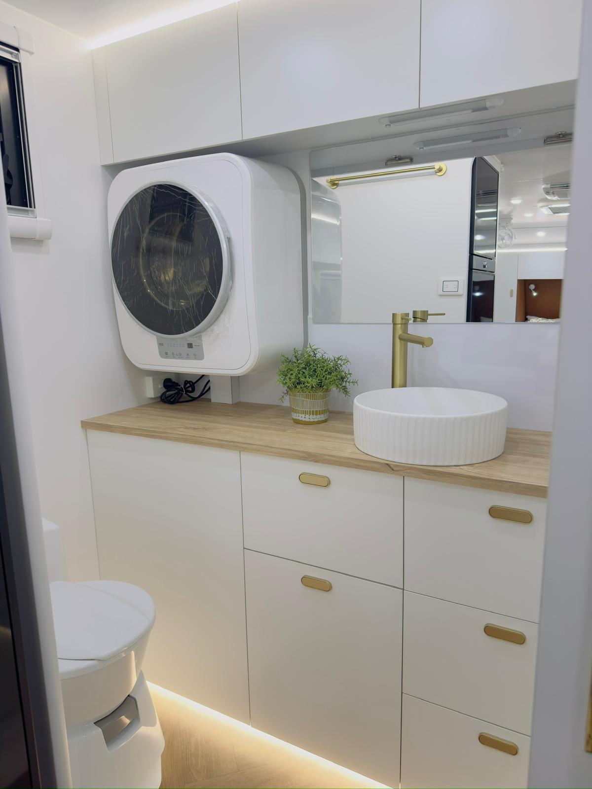 Caravan ensuite with vanity and washing machine